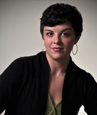 woman with short brown hair in black coat