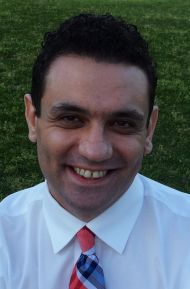 smiling man with dark hair
