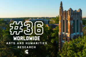 A photo of Michigan State University's Beaumont Tower rising through the trees. To the left of Beaumont Tower is the text: "#36 worldwide in arts and humanities research" with the Spartan helmet below the text.