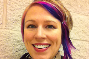 a women with blonde hair with purple and pink streaks