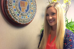 Kayla Putz next to Detroit Metro Convention sign