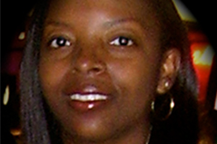 a women with long hair wearing hoop earrings