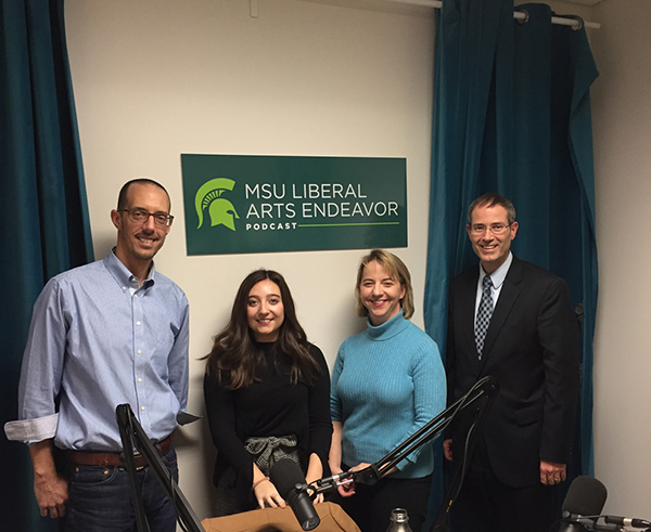 image of 2 women and 2 men posing for picture in the liberal arts endeavor podcast studio