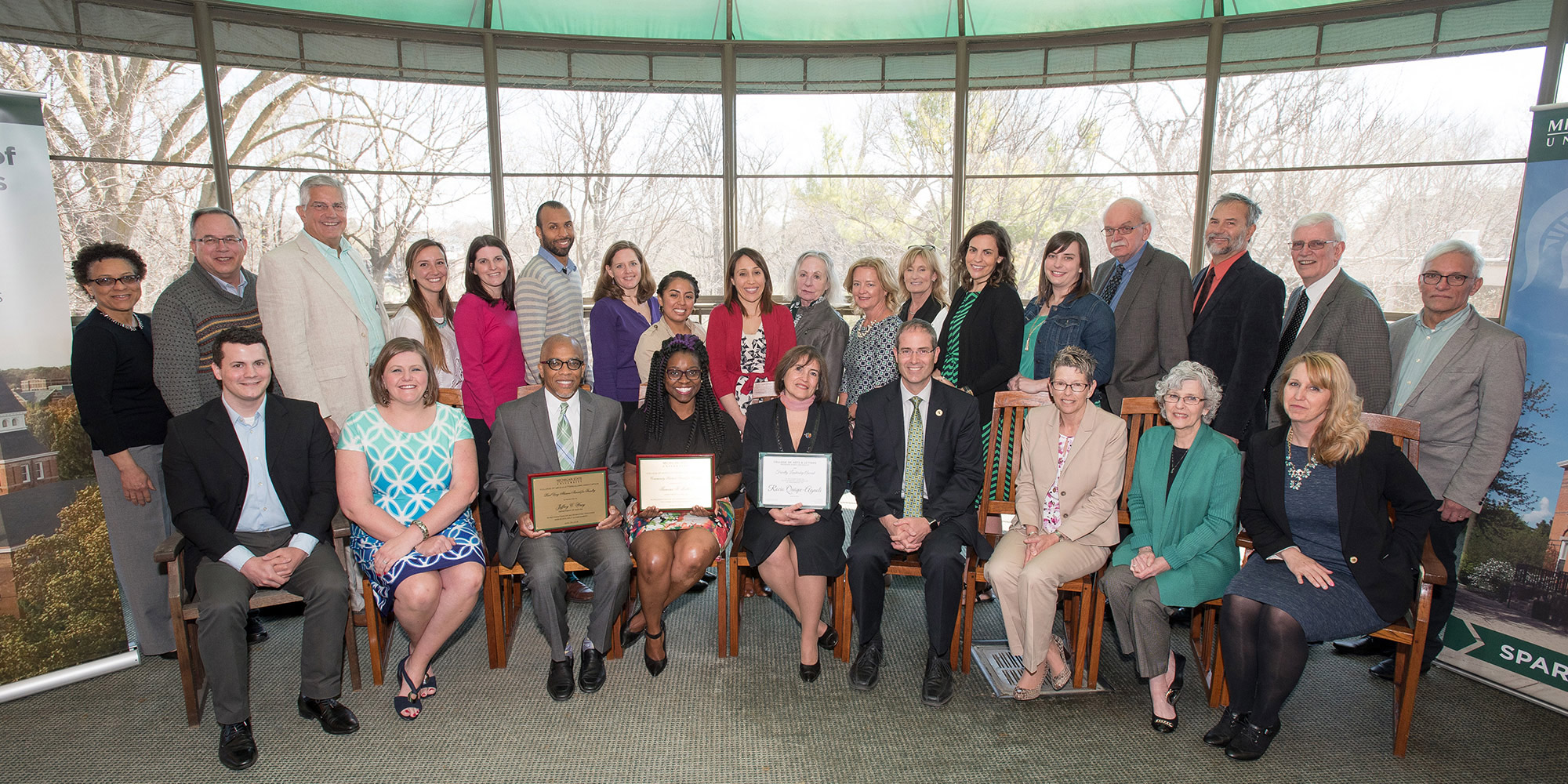 group picture of faculty with awards