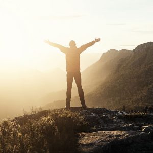 a person standing on top of a mountain