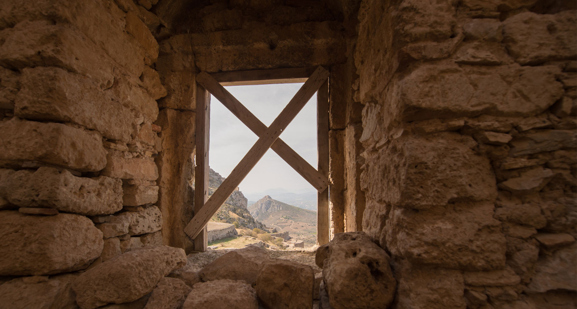 looking through rocks at landscape