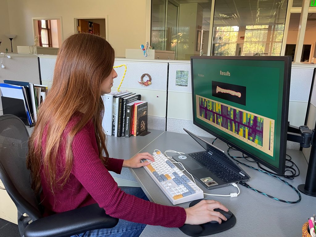 Natalie Clark at her desk, looking at data on her screen